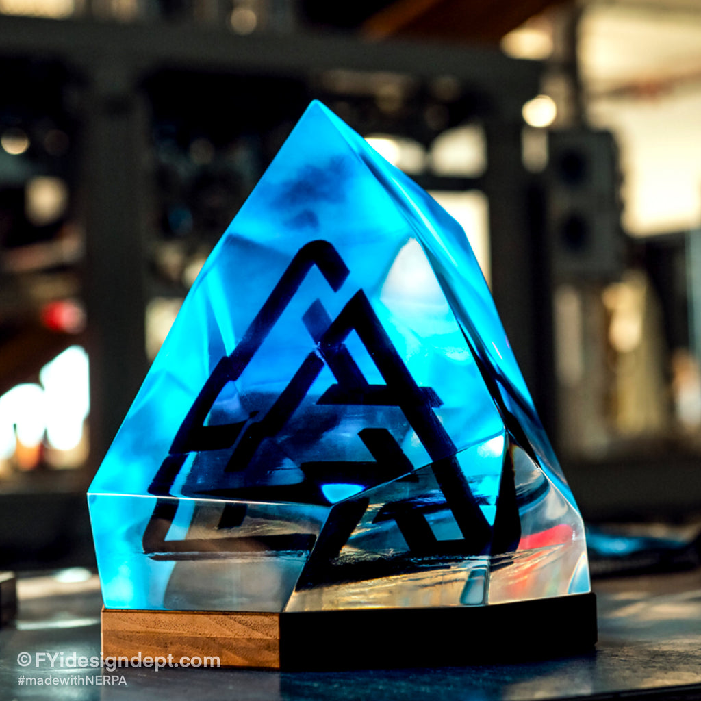 This unique project was done with Nerpa Polymers Casting Epoxy. This trophy represents the ice sculpture with encapsulated designer logo. The trophy is meant to be clear with possible blue light lighting