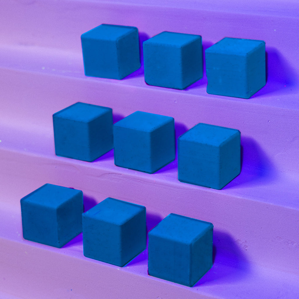 Blue cubes arranged on a purple surface with a gradient background
